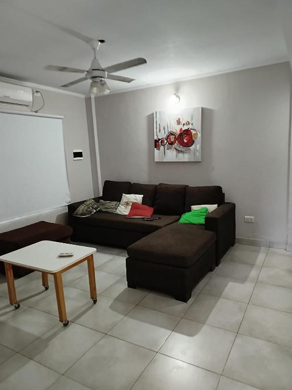 a living room with a couch and a table at Casa Ramirez in Posadas