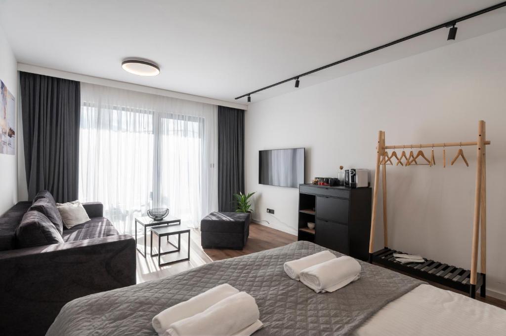 a bedroom with a bed with two pillows on it at Felicita Deluxe Apartments with Free Parking in Sarajevo