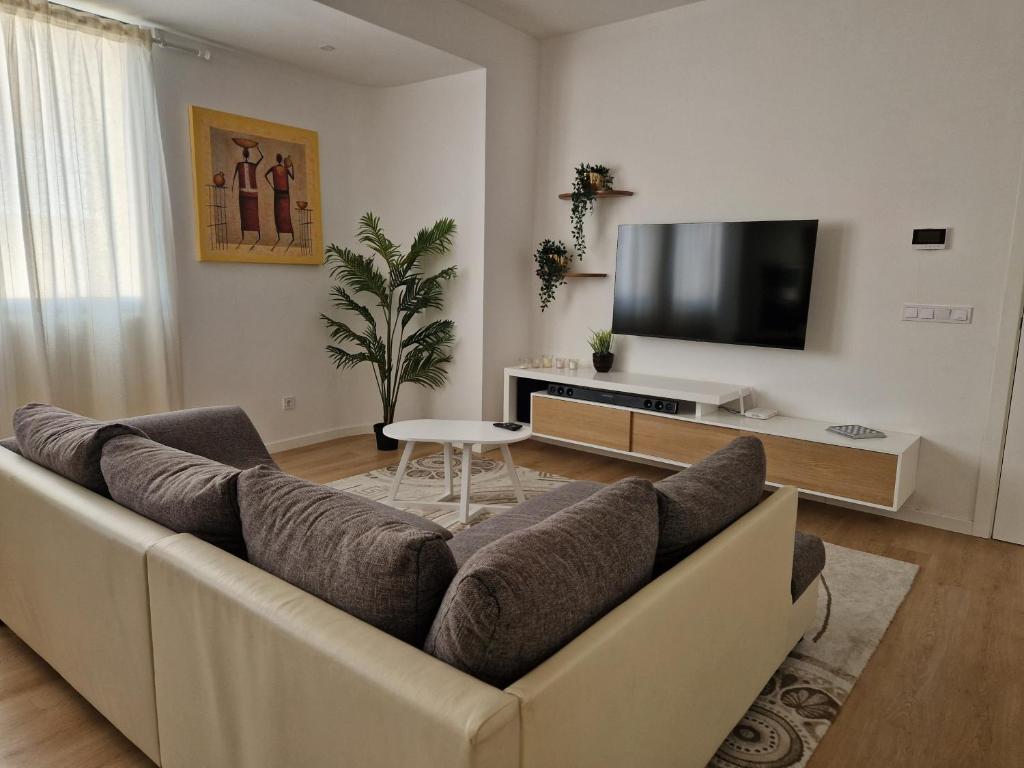 TV a/nebo společenská místnost v ubytování Sunset