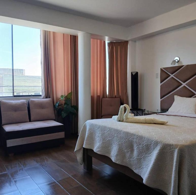 Llit o llits en una habitació de Princess Hotel