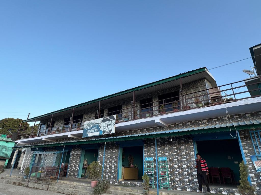 a building on the side of a street at Rudraksh Hotel And Restaurant in Amgarhi