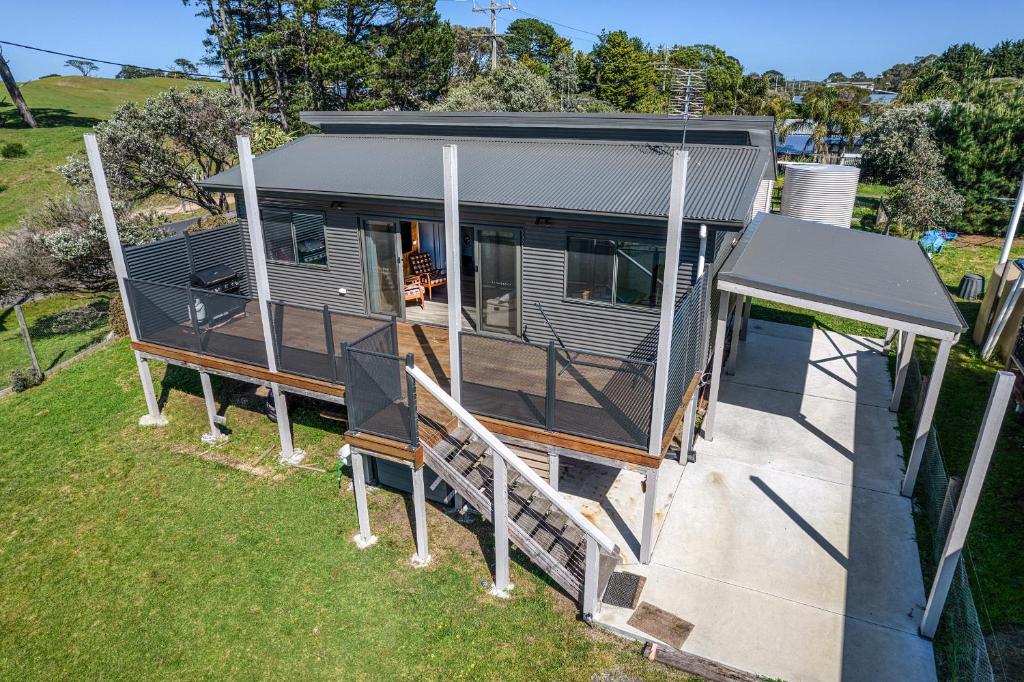 an aerial view of a tiny house with a porch at Lees Dream in Venus Bay
