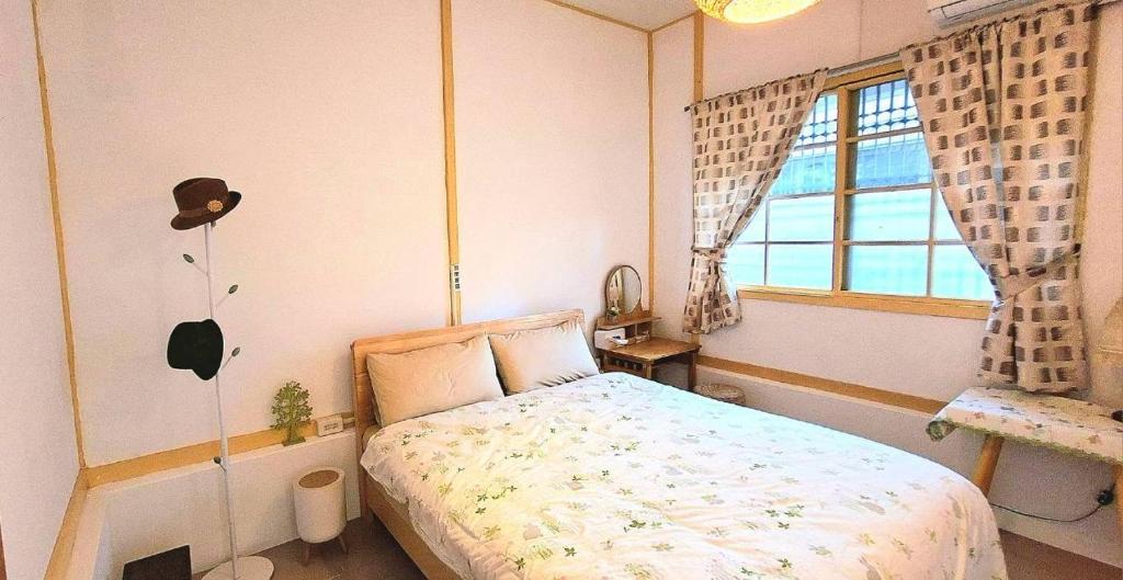 En eller flere senge i et værelse på 沐時光民宿