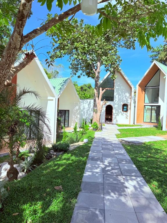 a walkway in front of a house at Lanta Forest Resort & Villas in Ko Lanta Yai