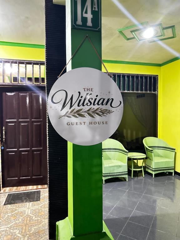 a sign that reads the wilkin guest house at The wilsian - Syariah guest house in Sengkaling