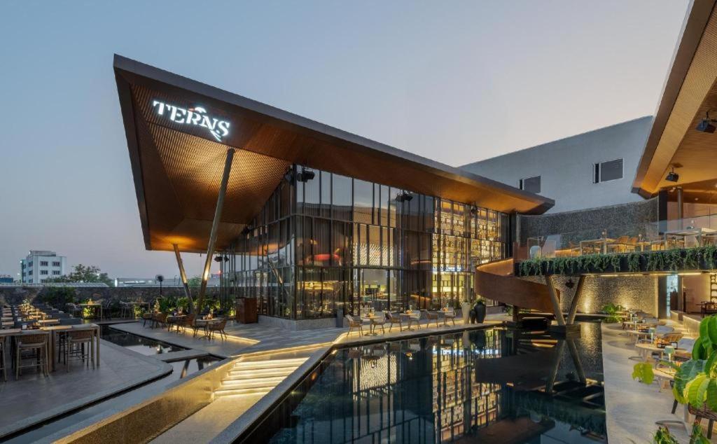 a rendering of a hotel with a swimming pool at Nes-Terns in Coimbatore