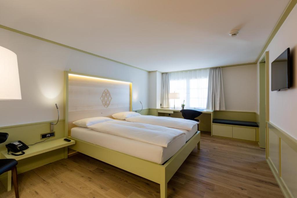 Postel nebo postele na pokoji v ubytování Hotel Krone Speicher