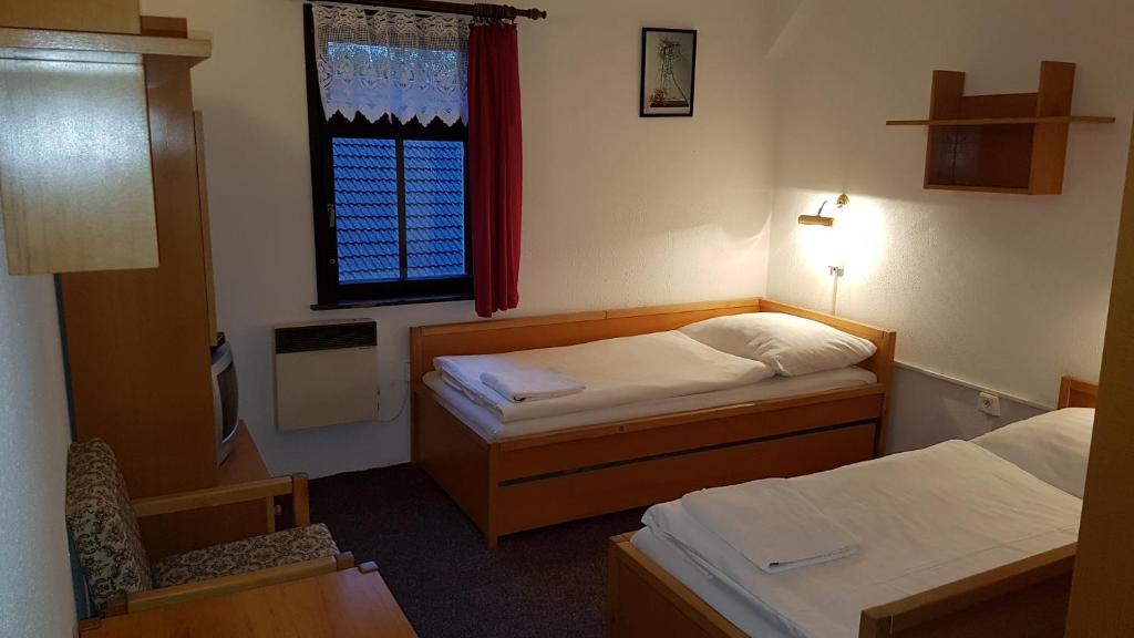 Postel nebo postele na pokoji v ubytování Penzion Přeštěnice