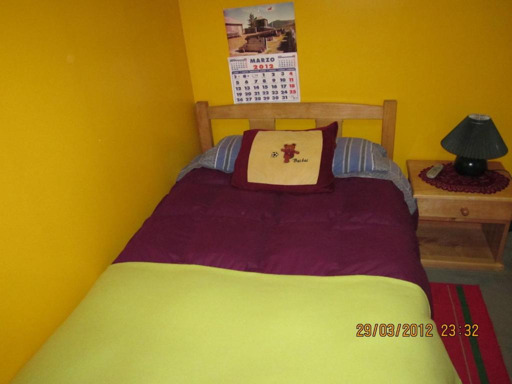 Postel nebo postele na pokoji v ubytování Hostal El Mirador