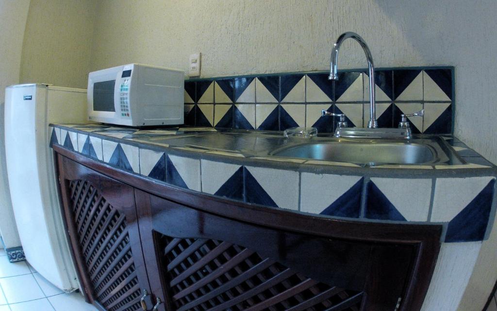 Kuchyň nebo kuchyňský kout v ubytování Hotel Rio Malecon