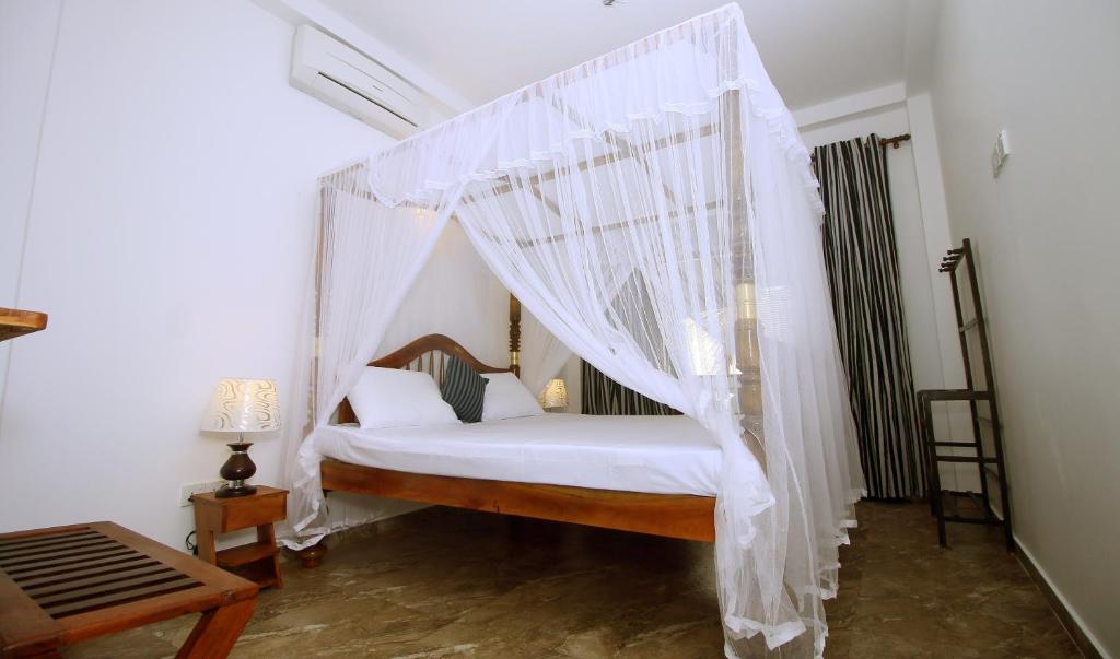 Postel nebo postele na pokoji v ubytování Il Nido Beach Home