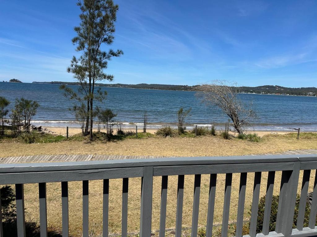a view of the beach from the balcony of a house at Pete's on the Beach in Batemans Bay