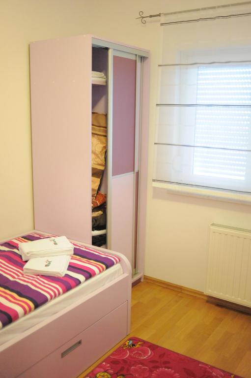 Postel nebo postele na pokoji v ubytování Apartmani Špoljar
