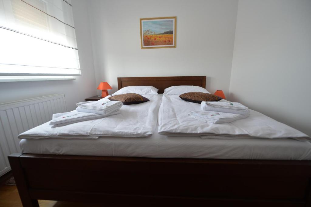 Postel nebo postele na pokoji v ubytování Apartmani Špoljar