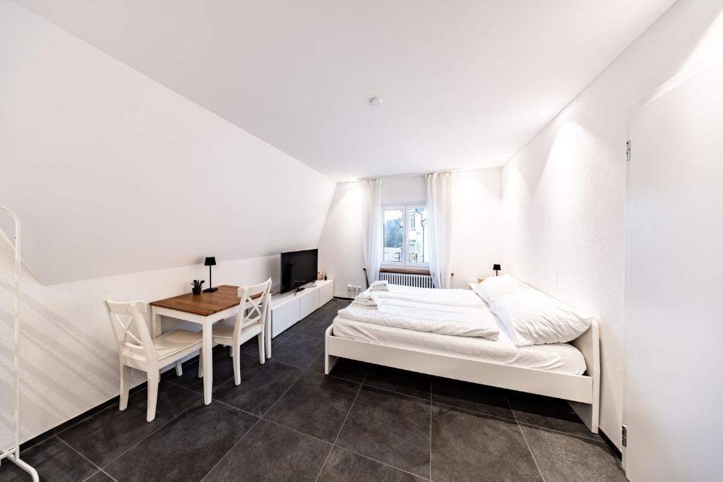 En eller flere senge i et værelse på Max Apartments