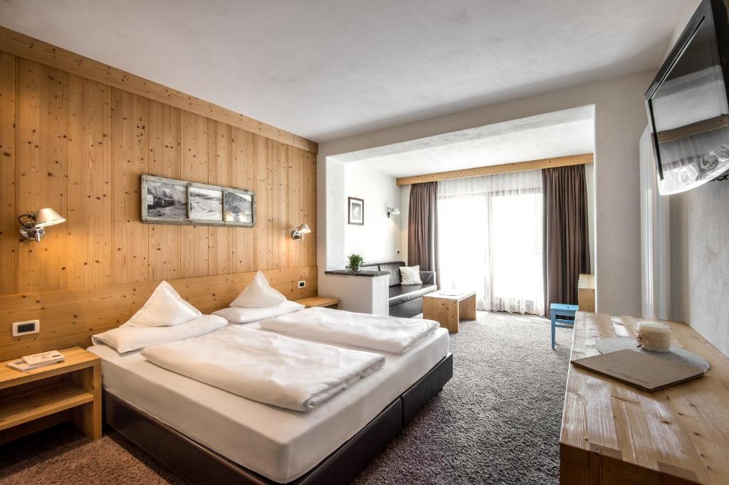 Posteľ alebo postele v izbe v ubytovaní Hotel Gran Ciasa
