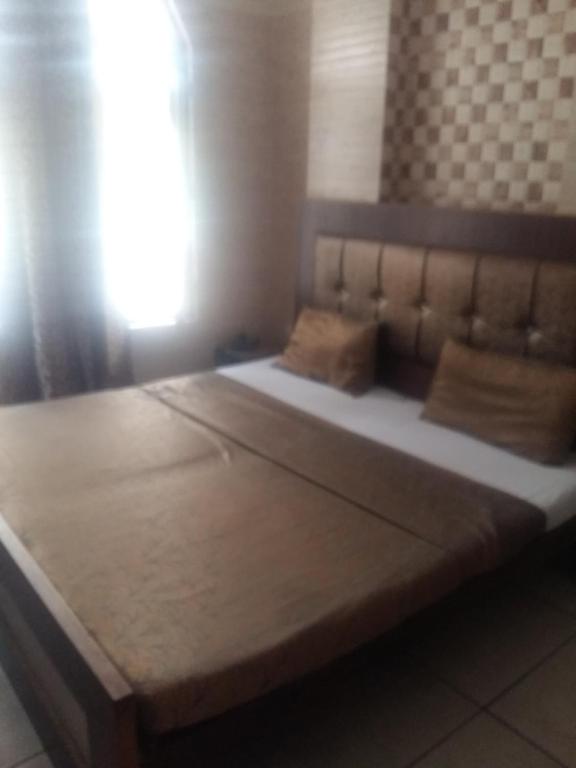 Postel nebo postele na pokoji v ubytování Hotel Grand