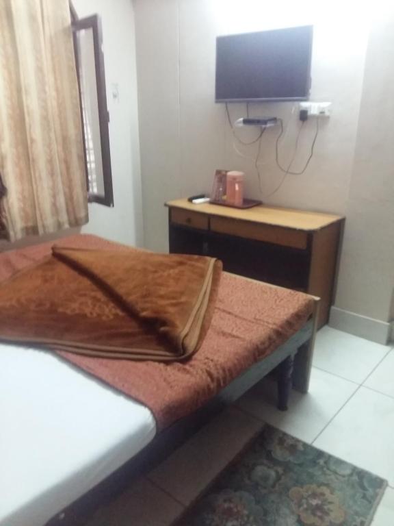 Postel nebo postele na pokoji v ubytování Hotel Grand