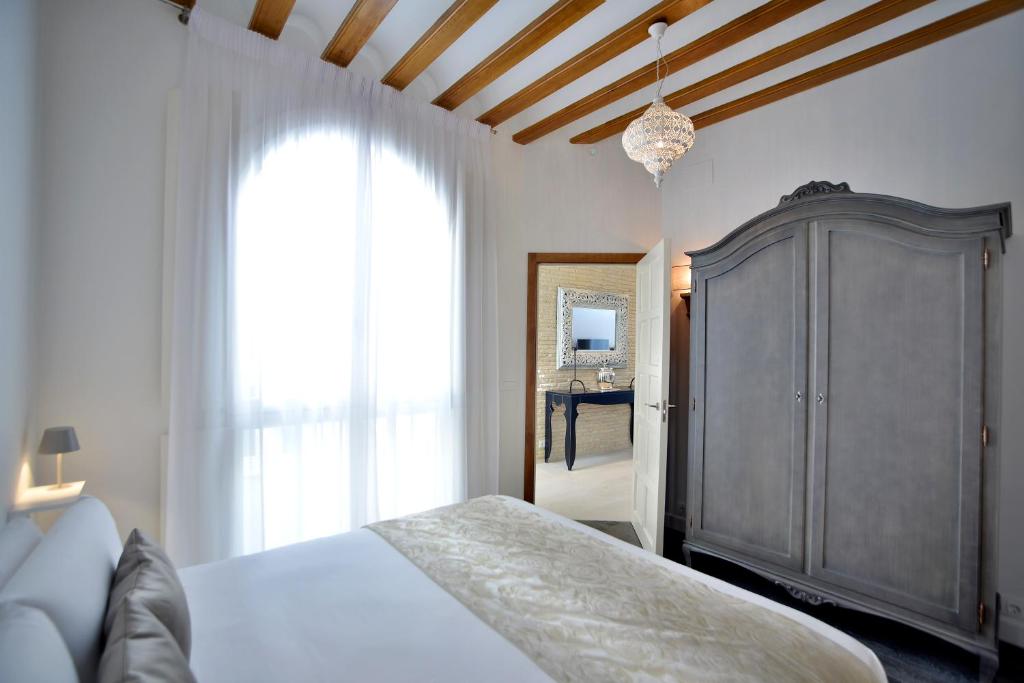 Postel nebo postele na pokoji v ubytování El Armador Casa Palacio by Luxury Suites Cádiz