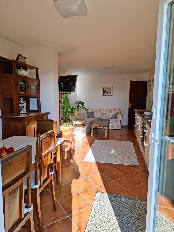 a living room with a table and a couch at Casa Hess in Velden am Wörthersee