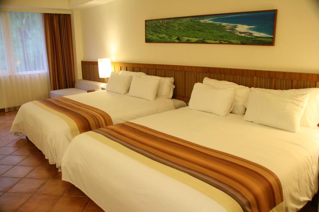 Postel nebo postele na pokoji v ubytování Fullon Resort Kending