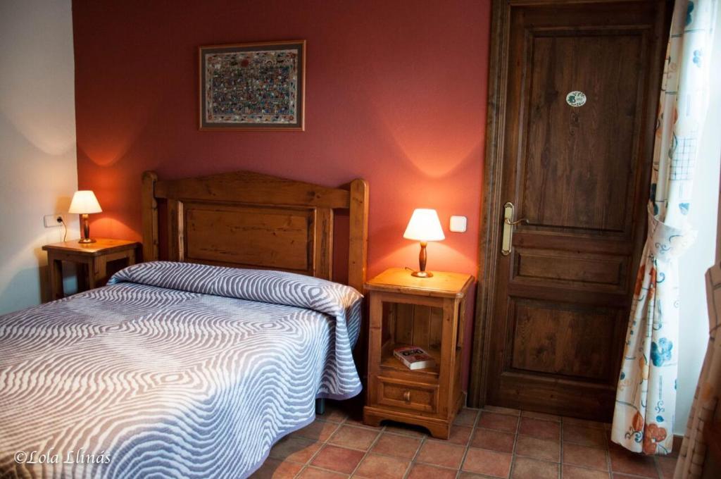 Postel nebo postele na pokoji v ubytování Sisquet Apartaments