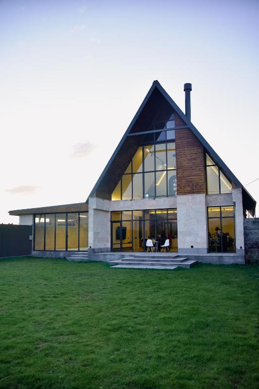 a large building with a large window at Arinest Villa with heated pool, 20 min from Yerevan in Elar