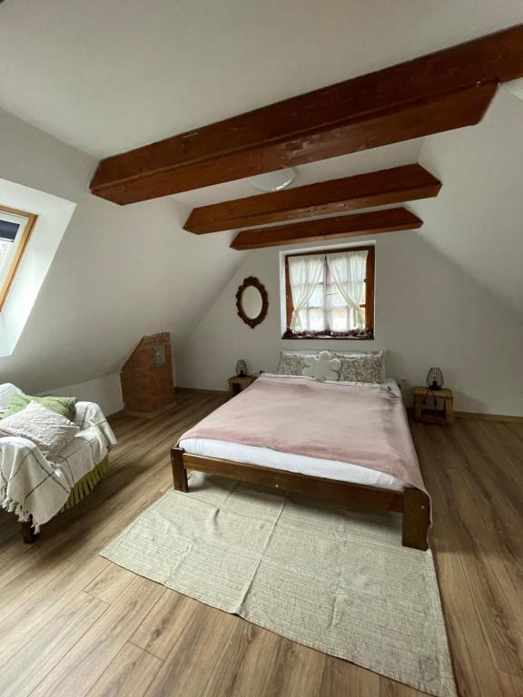 En eller flere senge i et værelse på Bogáncs Vendégház - Nagybörzsöny