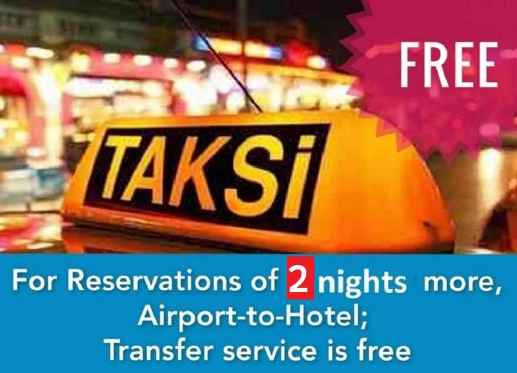 a taxi sign on a table in a store at Baku Khatai Hotel & Restaurant in Baku