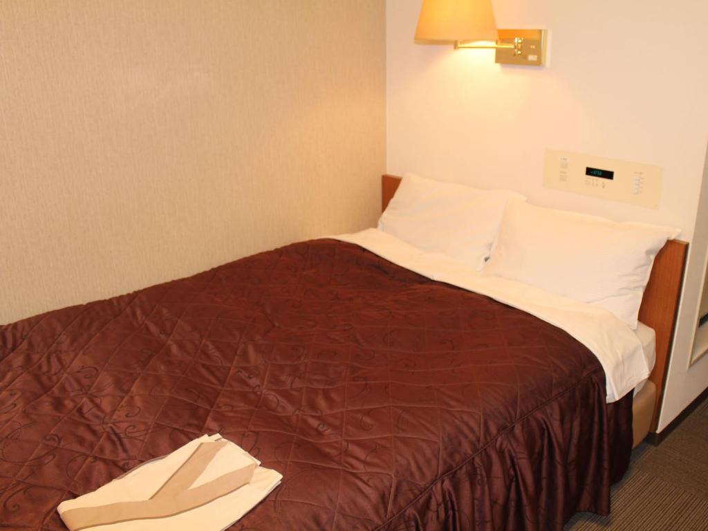 Postel nebo postele na pokoji v ubytování Hotel Trend Funabashi