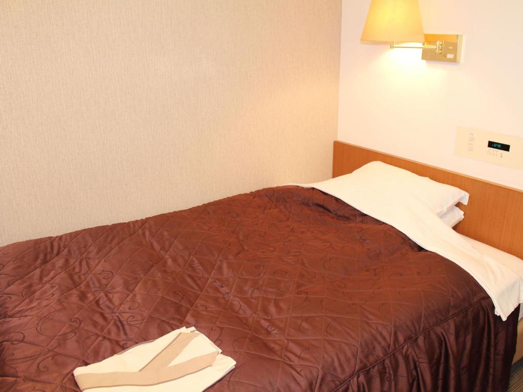 Postel nebo postele na pokoji v ubytování Hotel Trend Funabashi