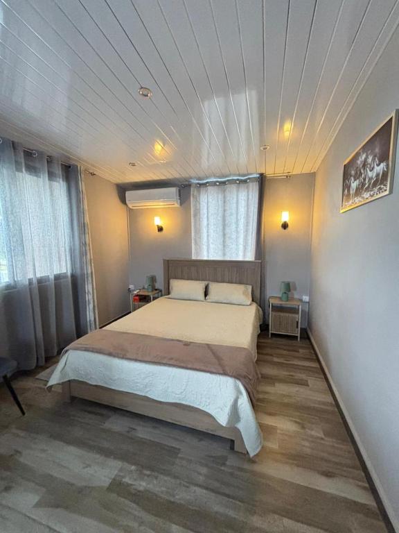 a bedroom with a large bed in a room at Raj Adventures Hideaway - 7 Cascades in Vacoas