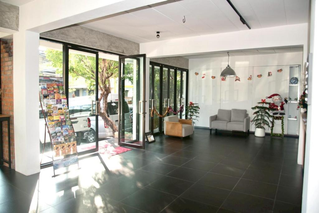 A bright, open lobby with seating and glass entrance doors.