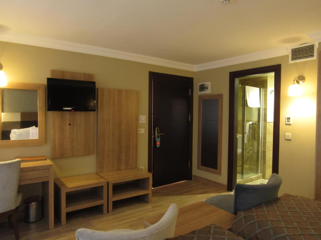 TV a/nebo společenská místnost v ubytování Kadikoy Park Suites