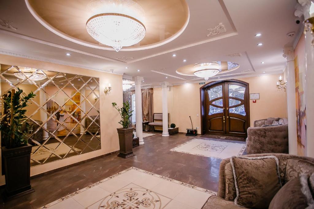 a living room filled with furniture and a large window at Aristokrat in Vinnytsya