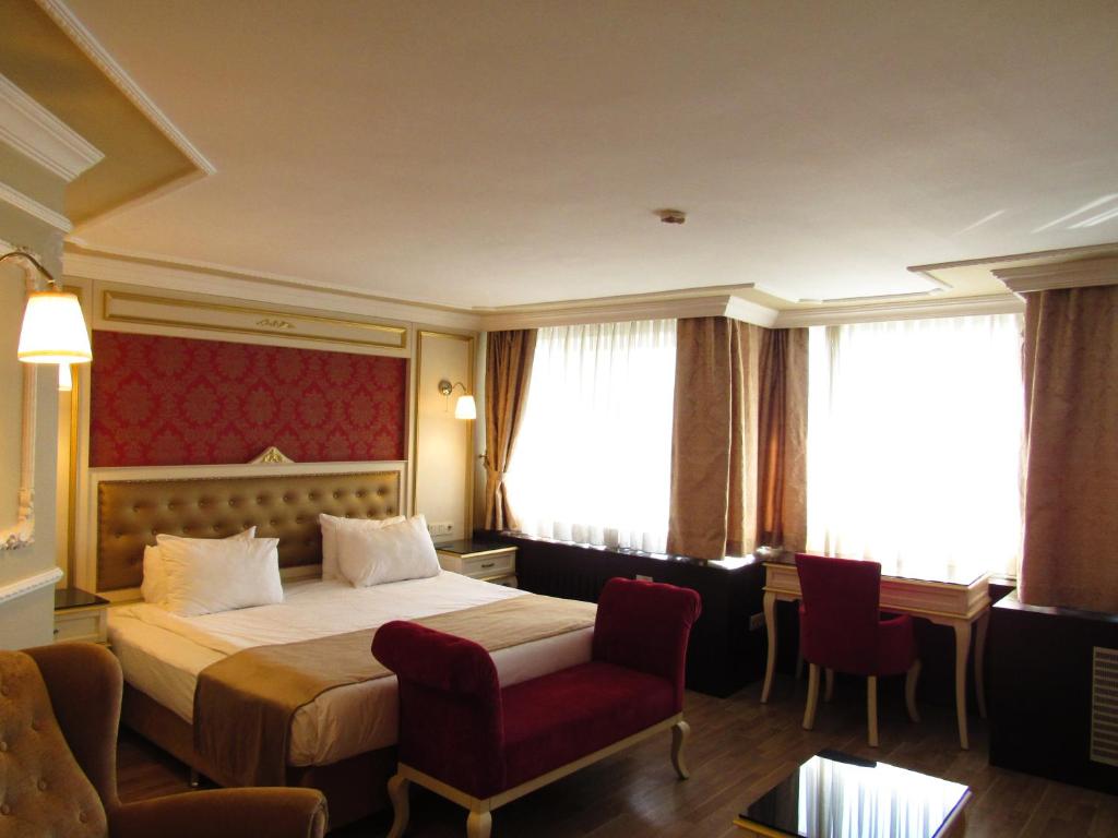 Postel nebo postele na pokoji v ubytování Kadikoy Park Suites