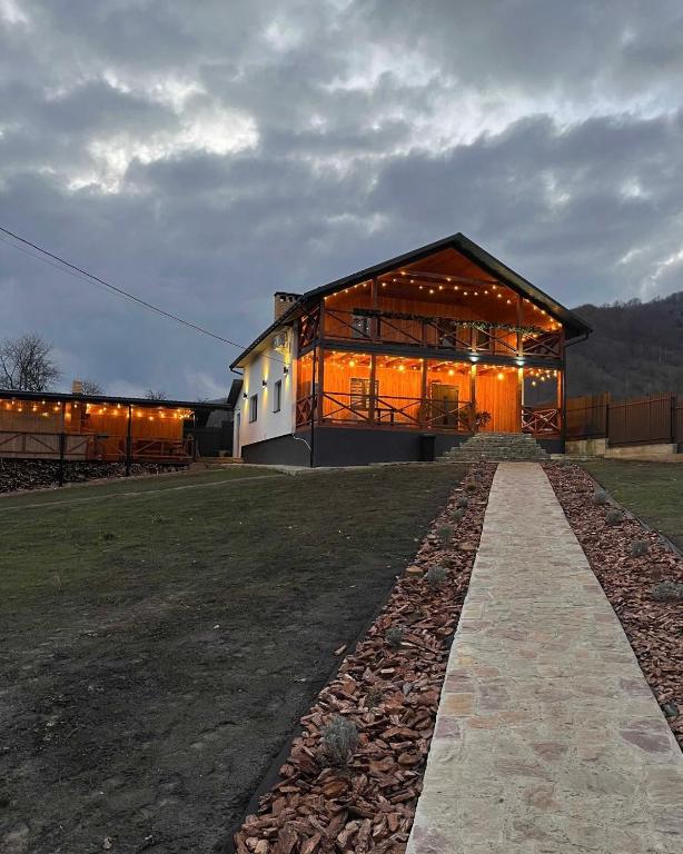 a large building with lights on the side of it at mountain house in Skhidnitsa