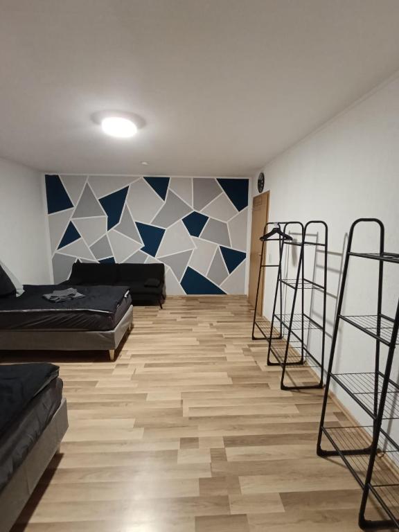 a room with two beds and blue and white walls at Praktische Monteurwohnung 2 Marl in Marl