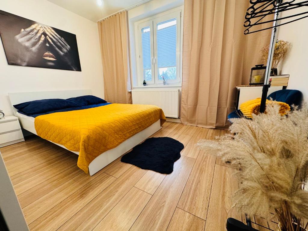 En eller flere senge i et værelse på Dominica Apartments