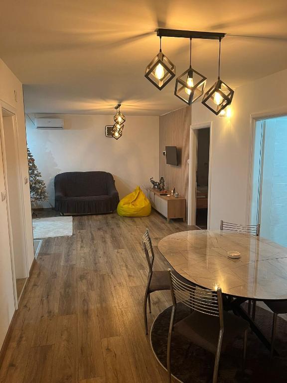 a living room with a table and a couch at NiLa in Ivanjica
