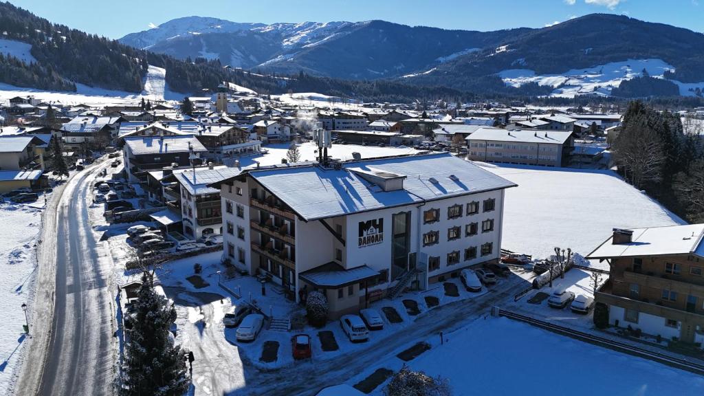 an aerial view of a town in the snow at Hotel Dahoam by Miha in Westendorf