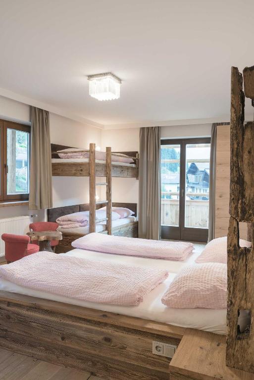 Postel nebo postele na pokoji v ubytování Atelier Garni Astei