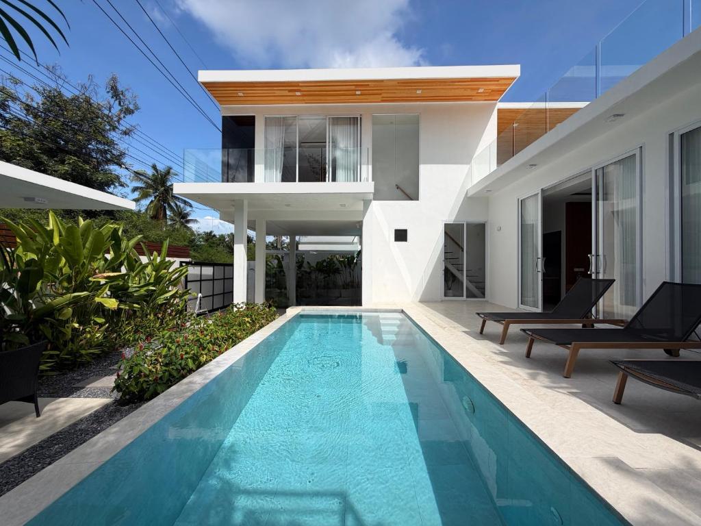 a swimming pool in the backyard of a house at Luxury Tropical Villa Samui - Shira in Koh Samui 