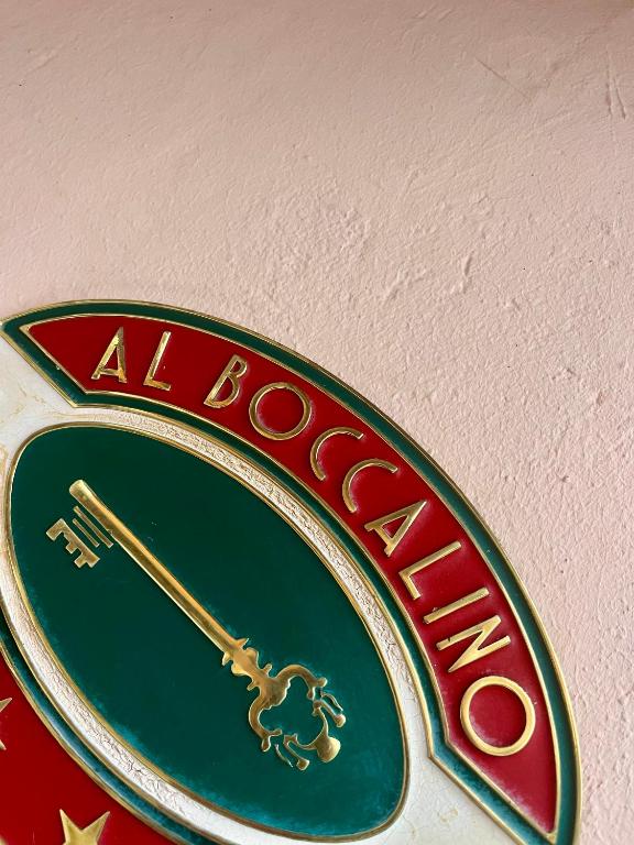 a close up of a alborne sign on a wall at AL BOCCALINO Bed & Breakfast Melide Lugano Ticino in Melide