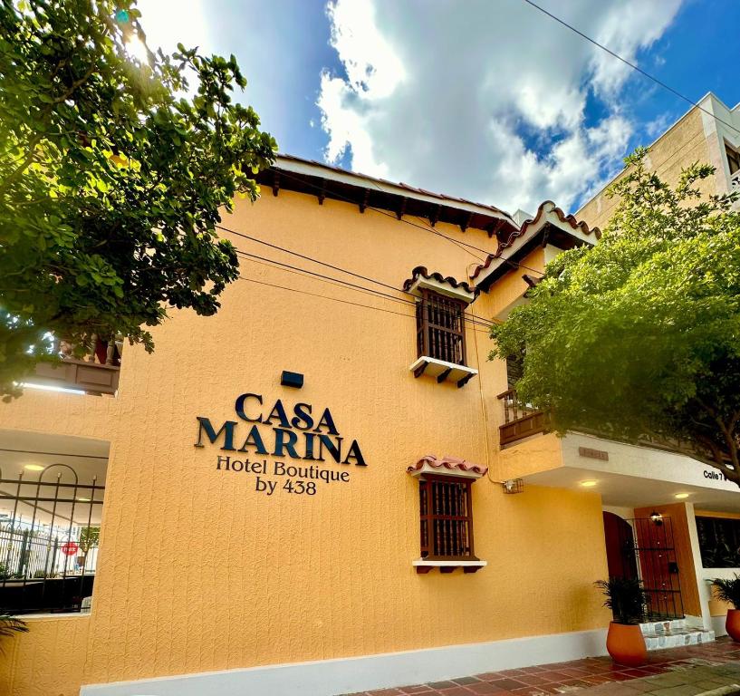 a building with a sign that reads casa mariana hotelburningdiretheus at Casa Marina Hotel Boutique in Ríohacha