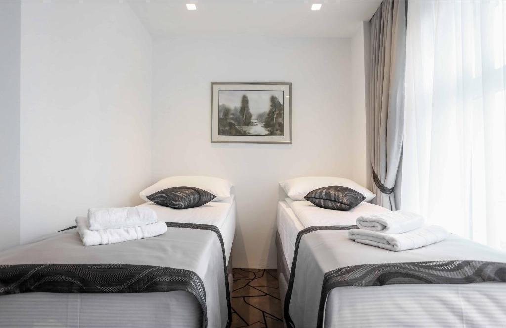 Postel nebo postele na pokoji v ubytování Hotel Grad