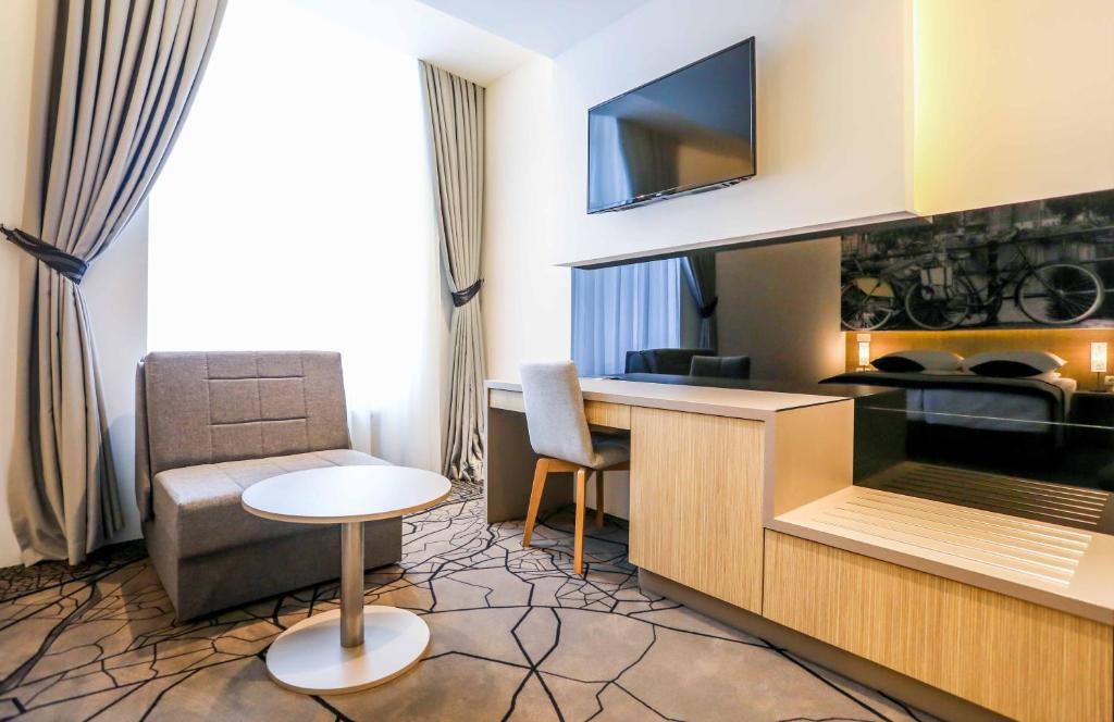 Kuchyň nebo kuchyňský kout v ubytování Hotel Grad
