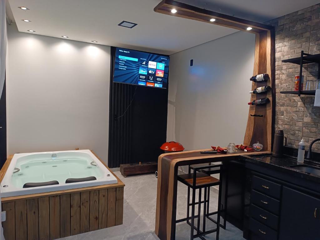 Et tv og/eller underholdning på Chalés Refúgio nas montanhas