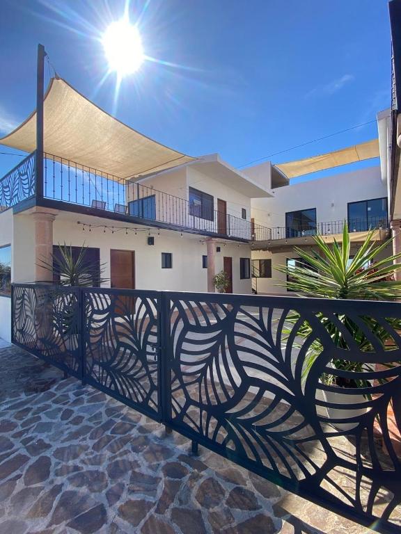 a house with a fence in front of it at Casa de los Agaves in Bernal