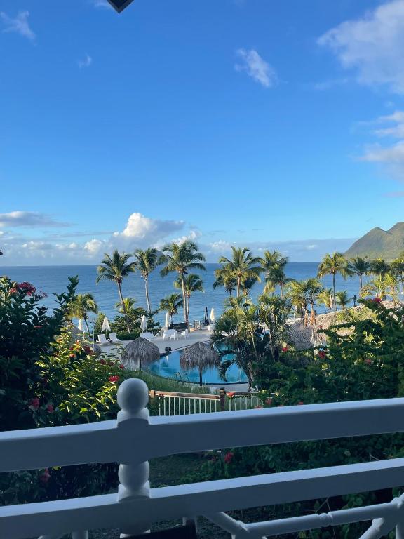 a view from the balcony of a resort at Appart chambre et salon in Le Diamant